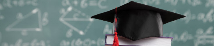 graduation hat in front of blackboard