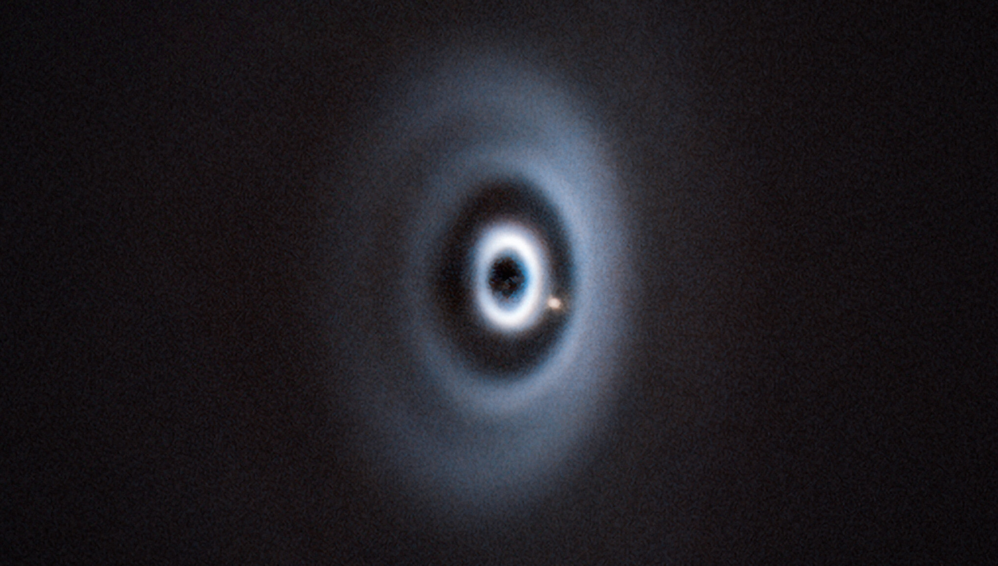 Infrared image of the concentric dust rings and the embedded planet around the young sun WISPIT 2.
