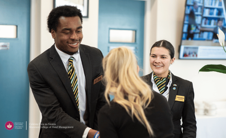students welcoming a guest