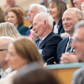 image of attendees sitting in the audience 