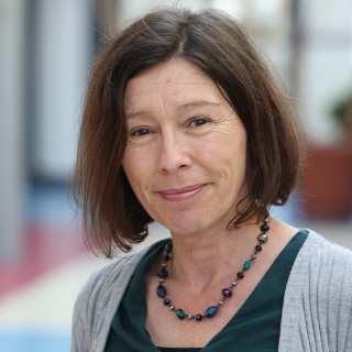 An Dr Jeannine Woods, BA, MA, PhD (NUI)