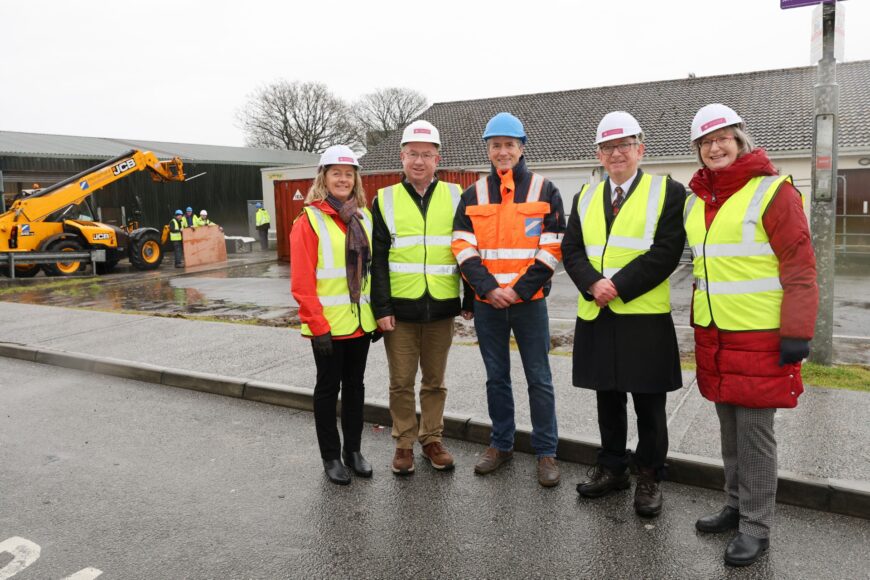 Learning Commons Enabling works Photo on building site with President Ciarán Ó hÓgartaigh, University Librarian Monica Crump and some of the Buildings & estates team.