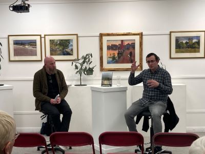 Dr Kenneth Coyne interviewing Dr Daniel Curley on the publication of his book in Kenny's art gallery, 21 November 2024.