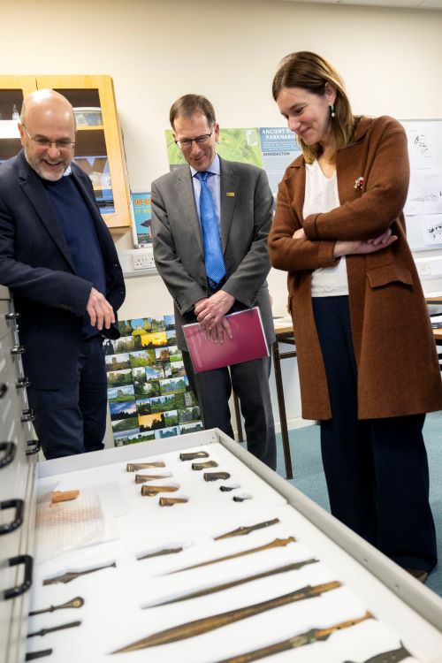 Dr Carleton Jones, showing Professor David Burn and Professor Rebecca Braun the artefact collection in the Discipline of Archaeology