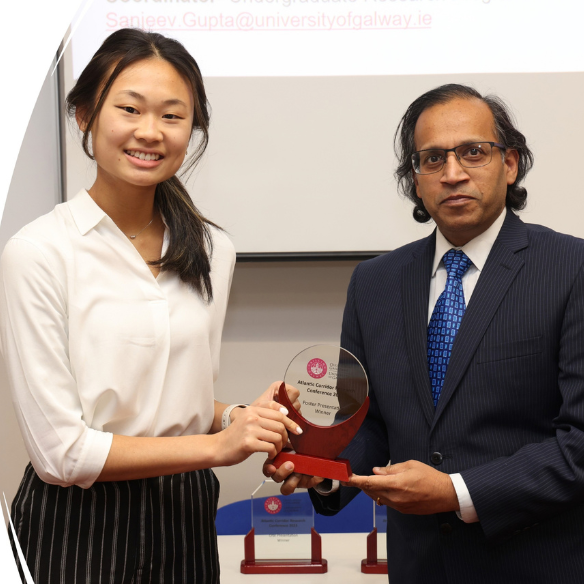 female student receiving her award from academic