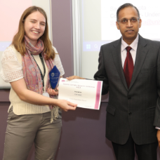 female student receiving her award from academic