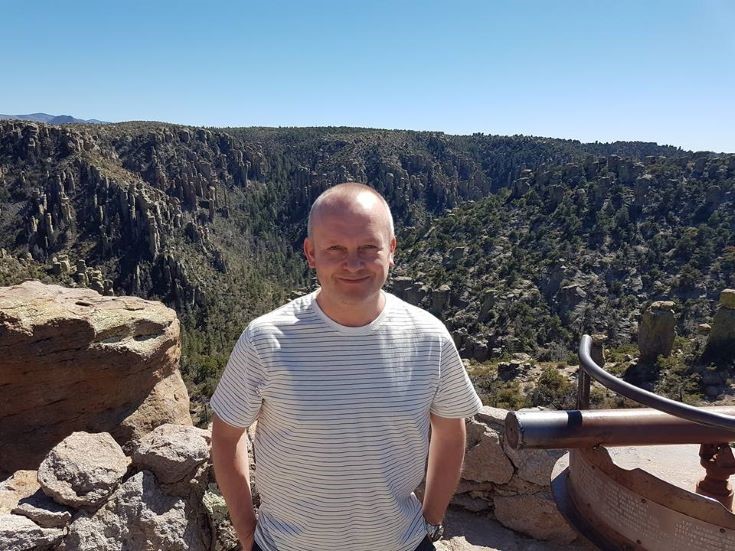 Dr Colin Lawton standing at a quarry in Morocco in the sunshine