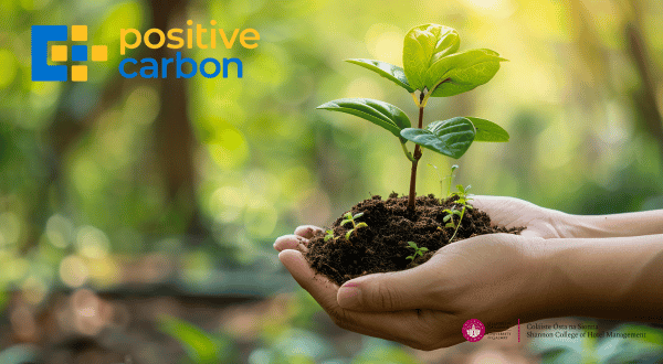 hands holding earth and plant