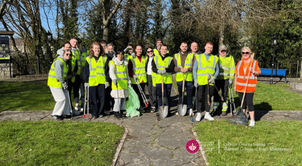 students wearing high vis jackets cleaning rubbish to help with ennis tidy towns