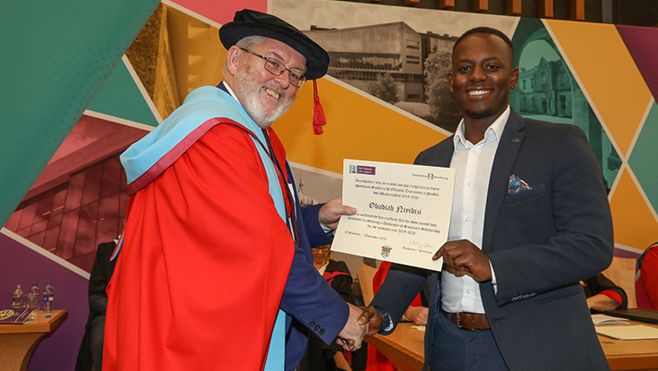 University of Sanctuary scholarship ceremony 2019-20 with Deputy President and Registrar and student