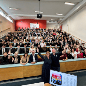 back of auditorium looking down at the presentaiton behind the students