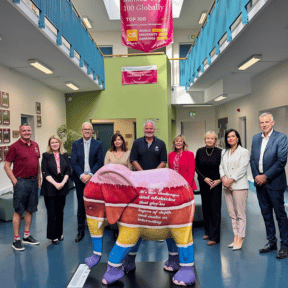 elephant for sarah pictured with university staff, co founders, and family of Sarah 